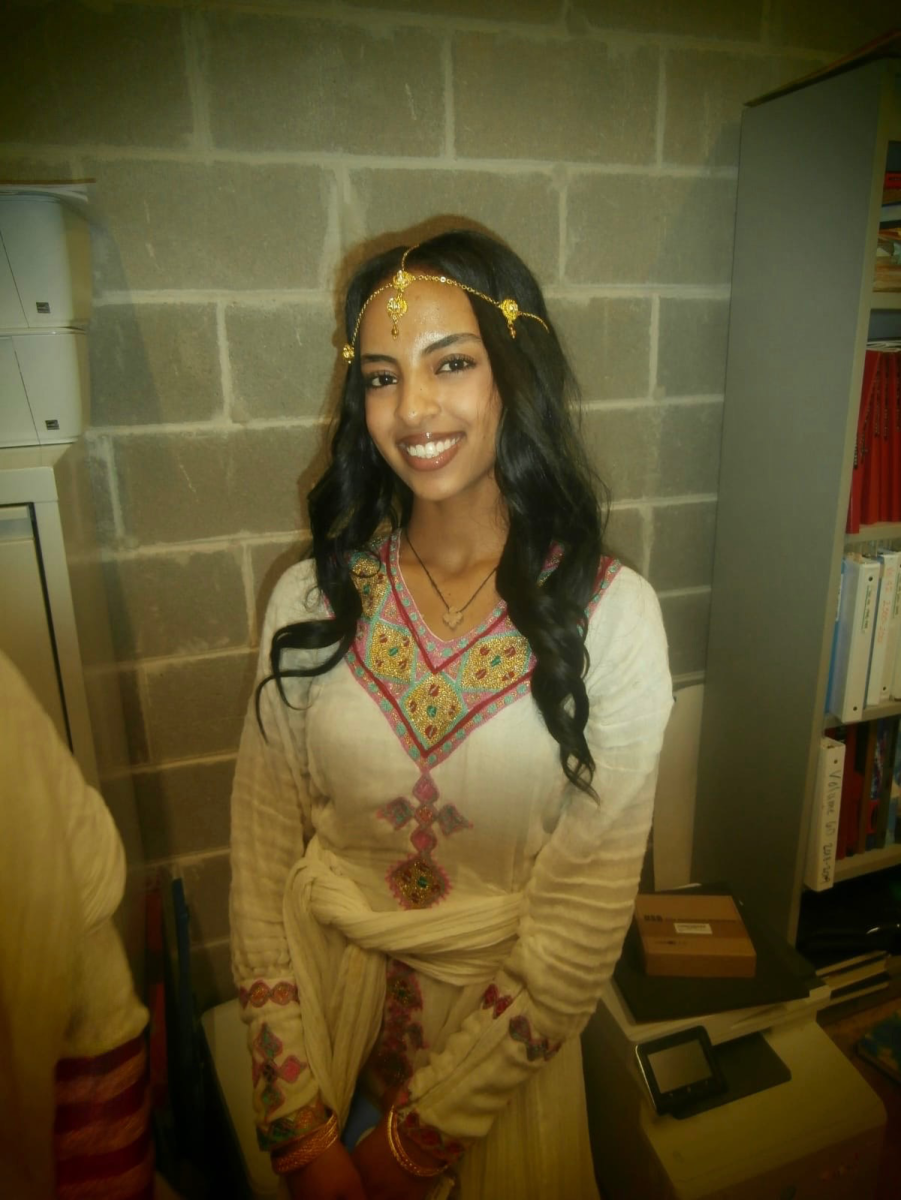 Junior Betiel Elma prepared backstage to dance at the Bellaire International Student Festival. Elma, who is Eritrean, performed with other members of the East African Student Association.