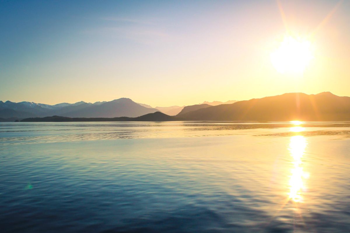 Alaskan sea and mountains during sunset