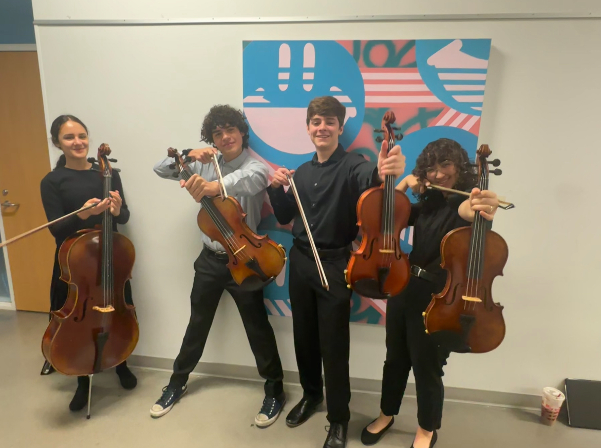 Sophomore Kyla Rocha poses with her chamber group from AFA. The group was preparing for a performance at the Kinder High School for the Performing and Visual Arts.