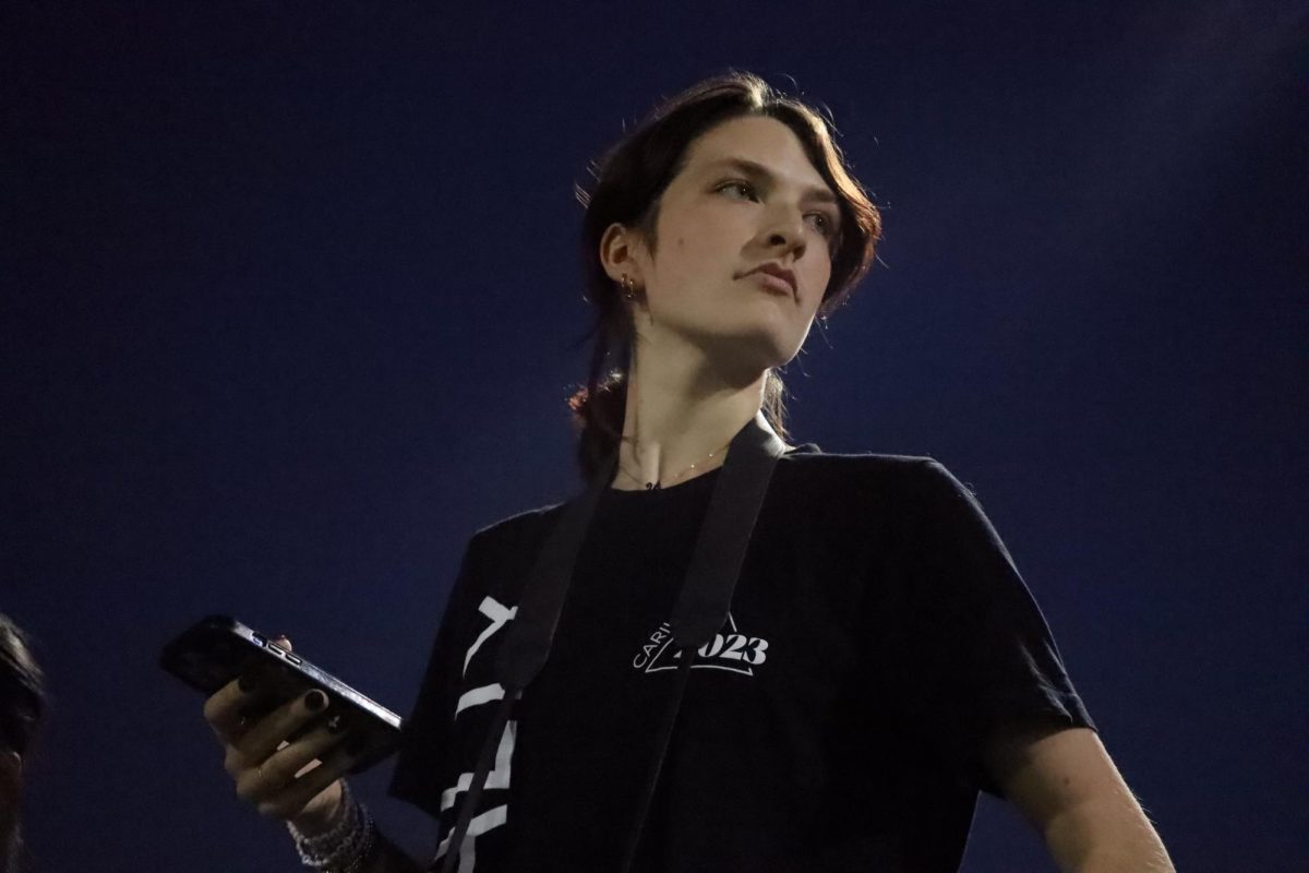 Rexford takes photos at a late-night football game. According to Rexford, going to games are “really cool because there are always nachos and overpriced candy.”
