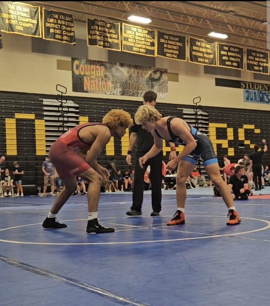 Senior Travis Barber faces off during Houston Districts for boy's wrestling in 2024. Barber won lost to the first seed from Strake Jesuit High School.