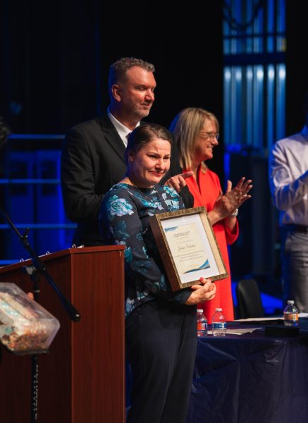 NHS co-adviser Jennifer Kuhleman gets emotional when receiving the certificate of appreciation. Kuhleman’s mother was in the audience, which made her feel “as if it was a recognition of her efforts as well.”