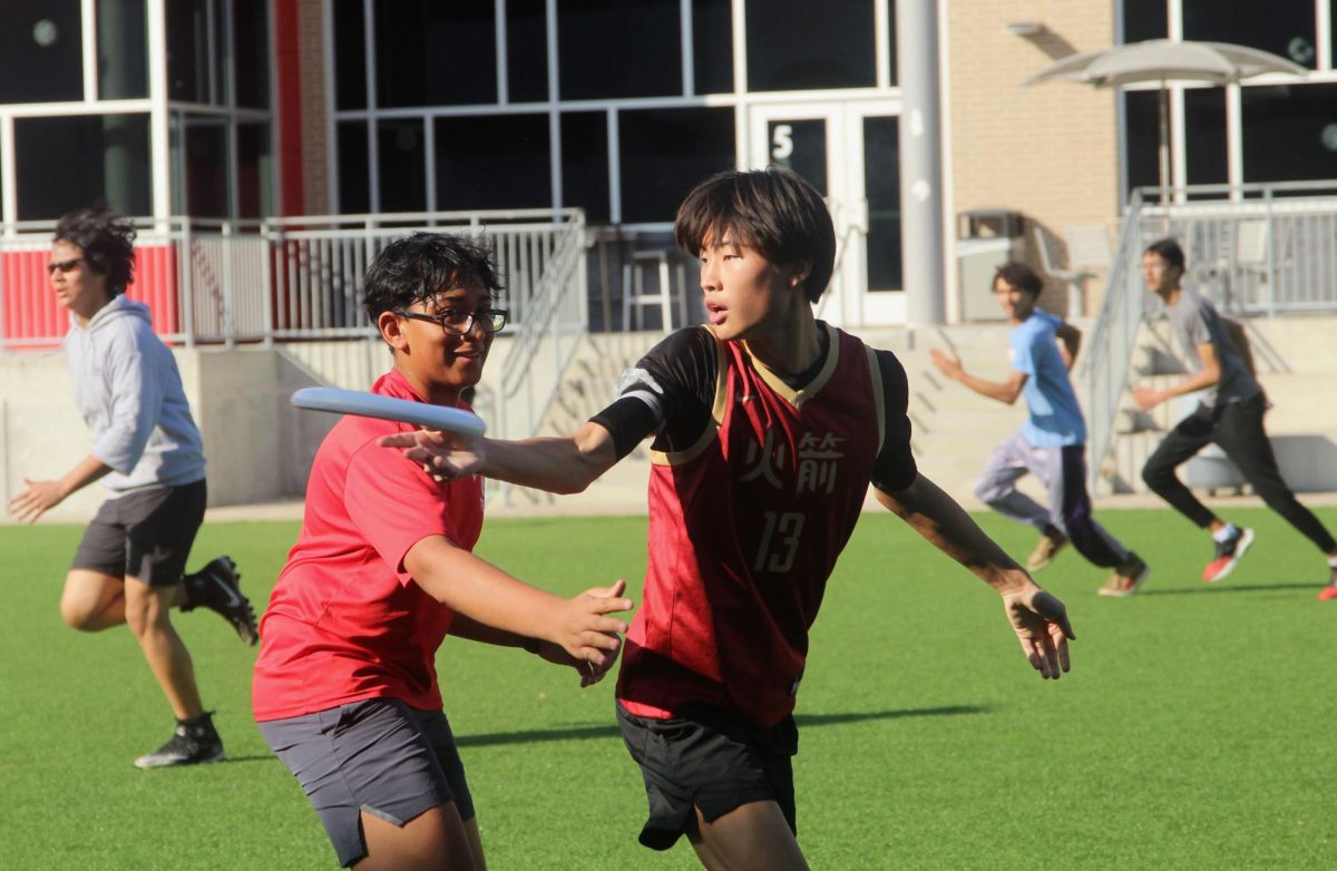 Senior Jacob Lee chucks the Frisbee away from senior Veer Tummala in a scrimmage with Carnegie Vanguard High School. Lee often played in weekend frisbee tournaments against other schools. (Photo by JESSICA WANG)