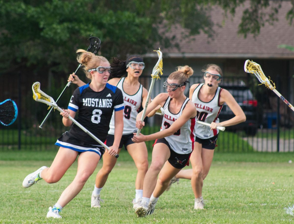 Senior Rachel Kohl defends as the Houston Christian mustangs make their way closer to their goal. Kohl attends Ridge Point High School in Fort Bend ISD but plays for the Bellaire Cardinals since Ridge Point does not offer lacrosse as a sport.