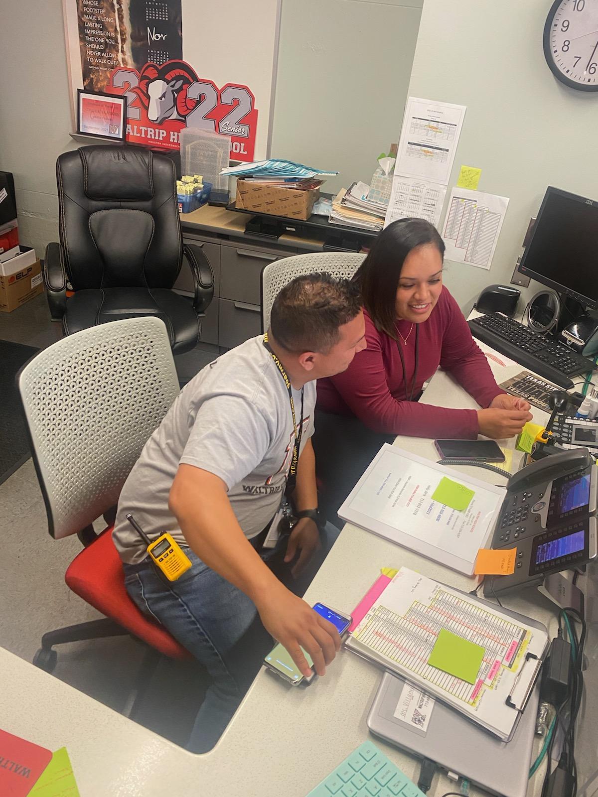 Lopez and his co-worker Yesely Molina Lopez prepare for the upcoming school day. Lopez worked with Molina at Waltrip High School for a year.