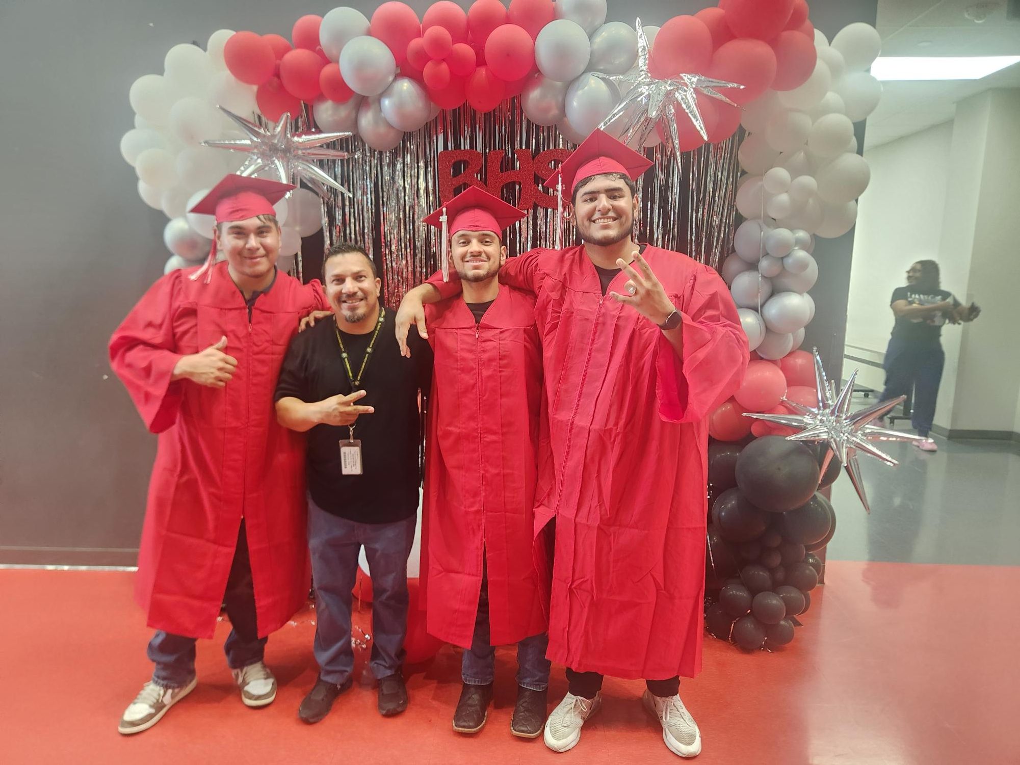 Lopez takes a photo with three Bellaire Seniors in the class of 2025. They wanted to “remember [me] forever,” Lopez said.