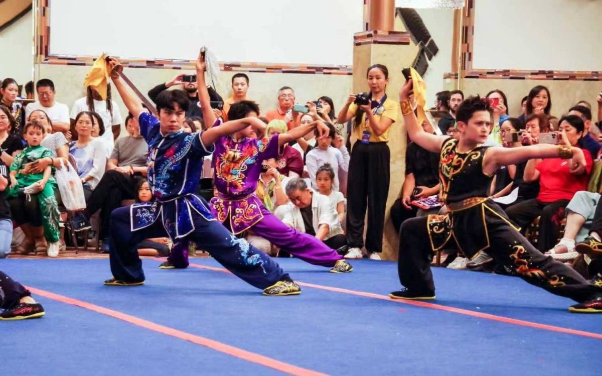 Sophomore Aldric Tanzil performs in the group sword form. “This was the climax of the performance and one of the hardest sections,” Tanzil said.