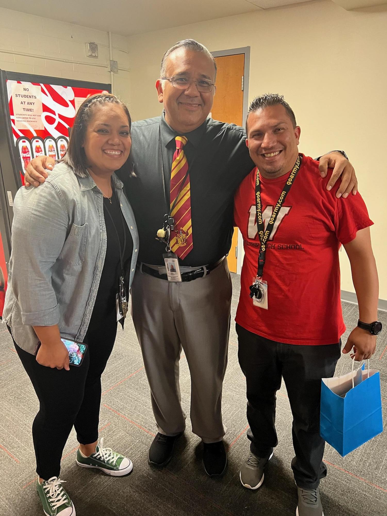 Lopez poses with his old colleagues, Assistant Principal Aaron Vasquez and former co-worker Yesely Molina Lopez. It was his last day working at Waltrip High School.