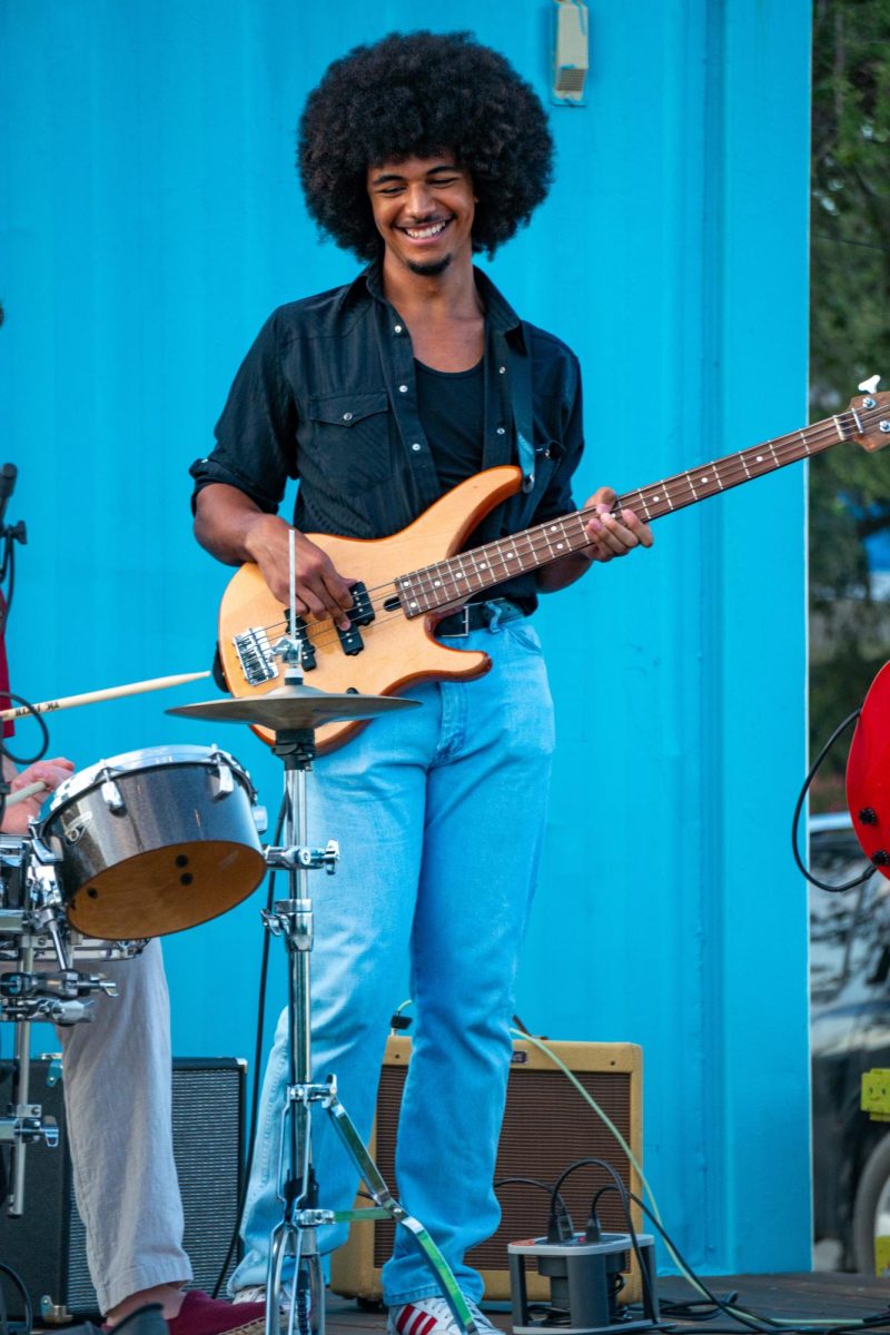 Percy plays the bass with a few former jazz band members at the venue Montrose Live. They wanted to play at as many venues as they could this past summer, so along with Montrose Live, they played at Evelyn's Park and the Contemporary Arts Museum.