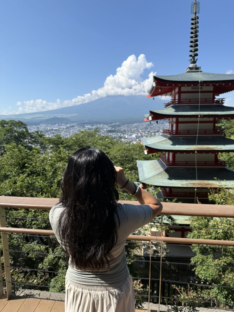 Sophomore Sofiya Khaderi looks out at the view of Mount Fuji and Chureito Pagoda. She captured the view on a clear day when the peak was only partly covered by clouds.