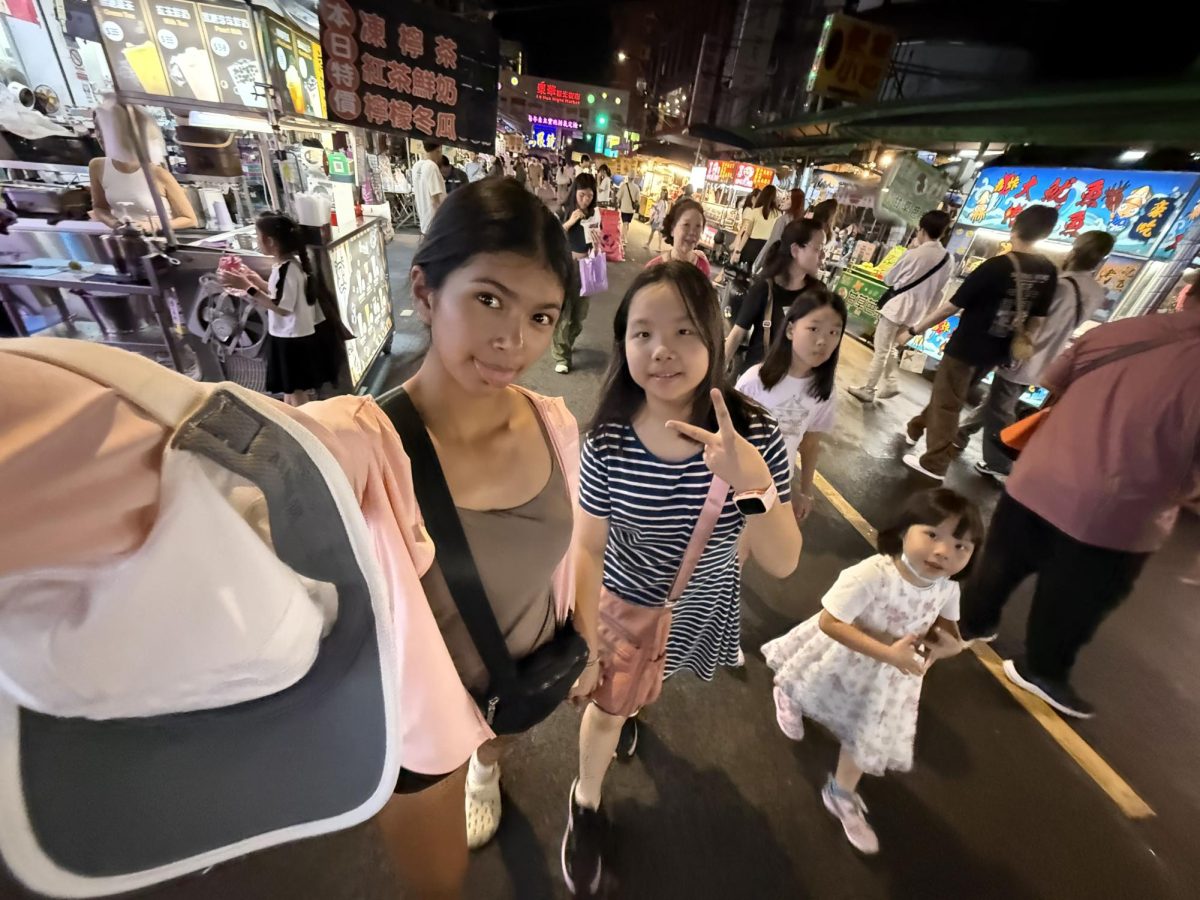 Junior Sydney Kottukkal visits a Taiwanese night market with her host family, while in Taipei over the summer of 2025. Kottukkal bought Tanghulu, jelly popsicles and a fruit drink from the night market.