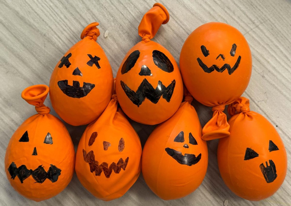 Members decorate their stress balls to look like jack-o-lanterns. In total, eight stress balls were donated to Pace Chiropractic and Physical Therapy.