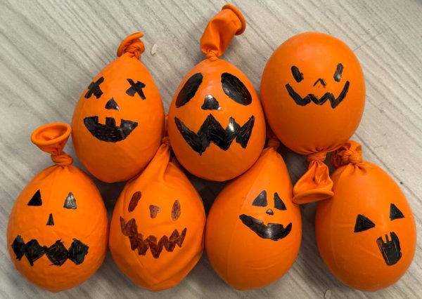 Members decorate their stress balls to look like jack-o-lanterns. In total, eight stress balls were donated to Pace Chiropractic and Physical Therapy.