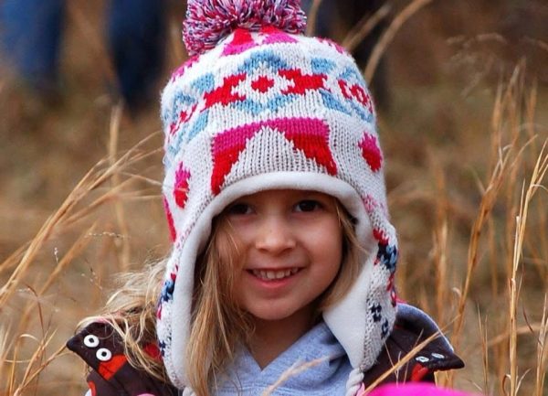 Etta Montgomery hikes through the woods behind her house in Ohio, surrounded by trees and gravel paths. When she lived there, exploring nature was one of her favorite parts of being home-schooled.