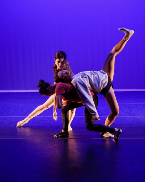 Wang, Seniors Sara Bangale and Naomi Roitershtein hold a pose. This was during their rehearsal before eMotion’s spring show.