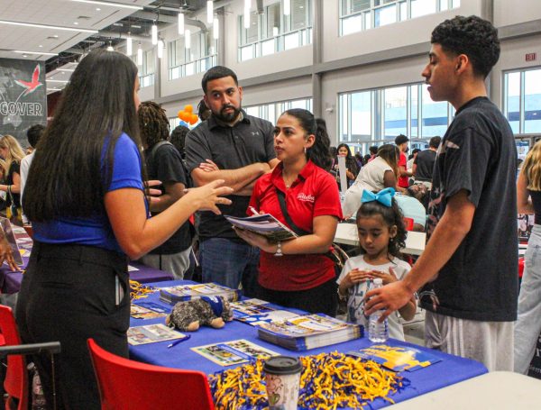 Regional Admissions Counselor Monica Hysquierdo speaks with a family at the Texas A&M University Kingsville booth. Prior to obtaining this role, she was the school’s Alumni Engagement Coordinator for one year.