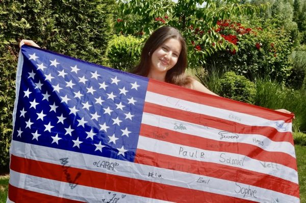 Elissa Wiese poses in front of her first American flag. “We rarely have flags in Germany, many people aren’t proud because they think it’s weird”.