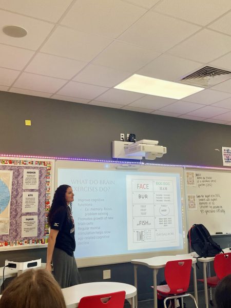 Vice-President and Junior Eva Muscal teaches members about brain exercises to practice. Members then practiced these new skills with each other to de-stress.
