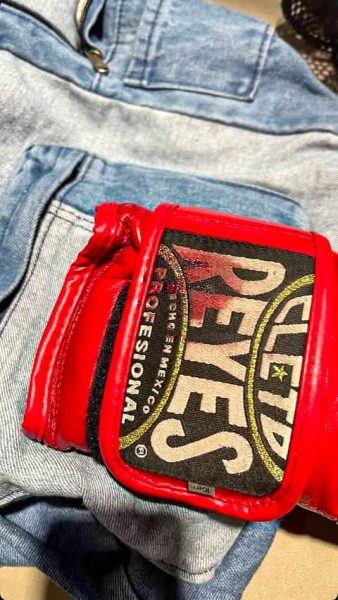 After taking a hard hit, junior Hyder Damad stains his glove with blood from a nosebleed. Through sparring, he built the endurance needed to withstand the injuries and keep fighting.