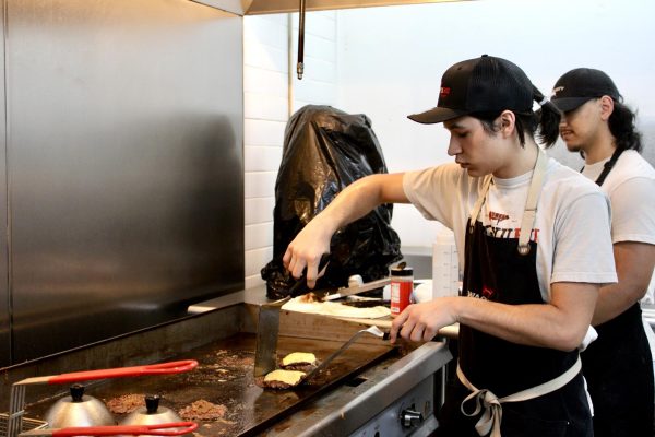 Carrizal prepares the patties for Wagyuru's smashburgers. On busy days, Carrizal and Cavanaugh work on the grill simultaneously, but they alternate on “calm days.”