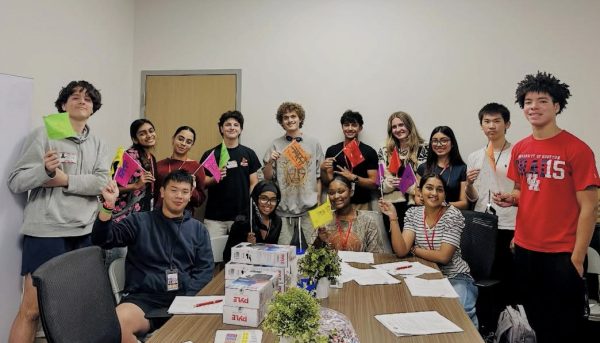 All 17 Ambassadors hold their handmade flags during the first Magnet Ambassador meeting of the year. Each ambassador represented one of Bellaire’s nine languages.