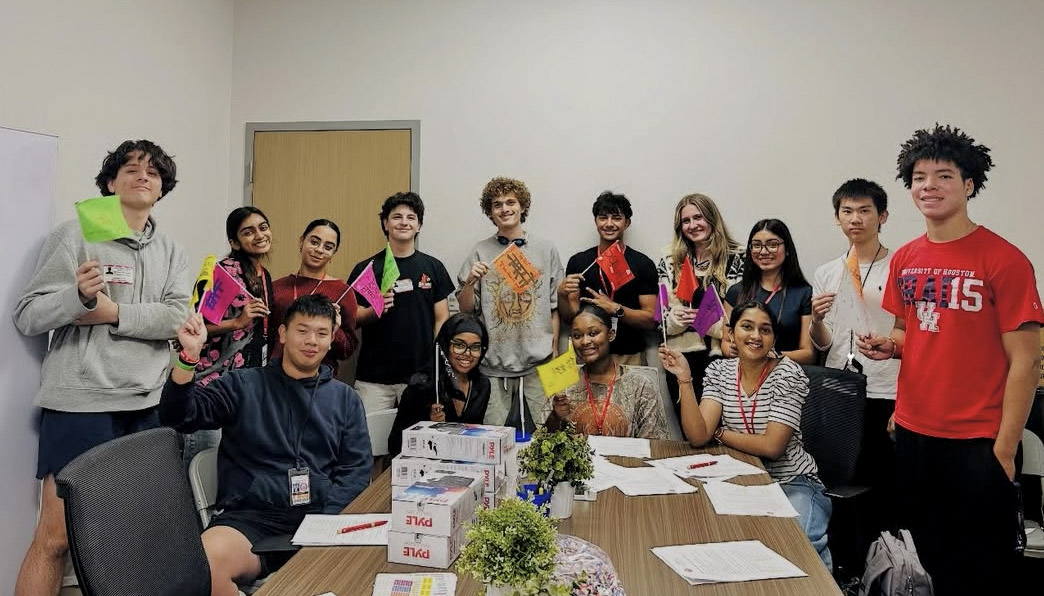All 17 Ambassadors hold their handmade flags during the first Magnet Ambassador meeting of the year. Each ambassador represented one of Bellaire’s nine languages.