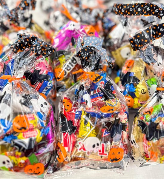 The National Beta Club stuffs candy goodie bags with different kinds of treats and candies. The bags were donated to the Nehemiah Center, emphasizing the importance of service to the community.