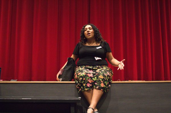 Princeton Assistant Director of Admission Elysia Garza introduces herself and Princeton University’s mission at the university’s visit in the auditorium on Oct. 14. “Princeton's motto is ‘in the nation service and in the service of humanity,’” Garza said. “Students are really excited about getting education, but also using that education to give back to the world around them.”