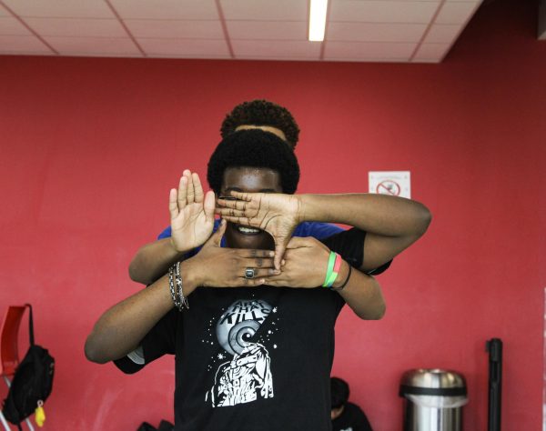 Rougier and Bogus strike a choreographed pose after the main chorus of "Gnarly" by Katseye.  The pose spotlights the facial expression Rougier makes.