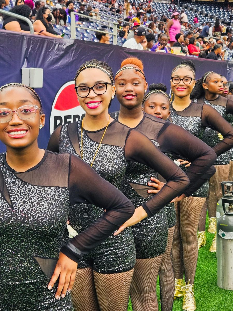 Horn and her team take a group picture during their performance at the National Battle of the Bands. Battle of the Bands is an annual event held at the NRG Stadium that brings together eight collegiate marching bands from across the nation, specifically focusing on historically black colleges and universities.