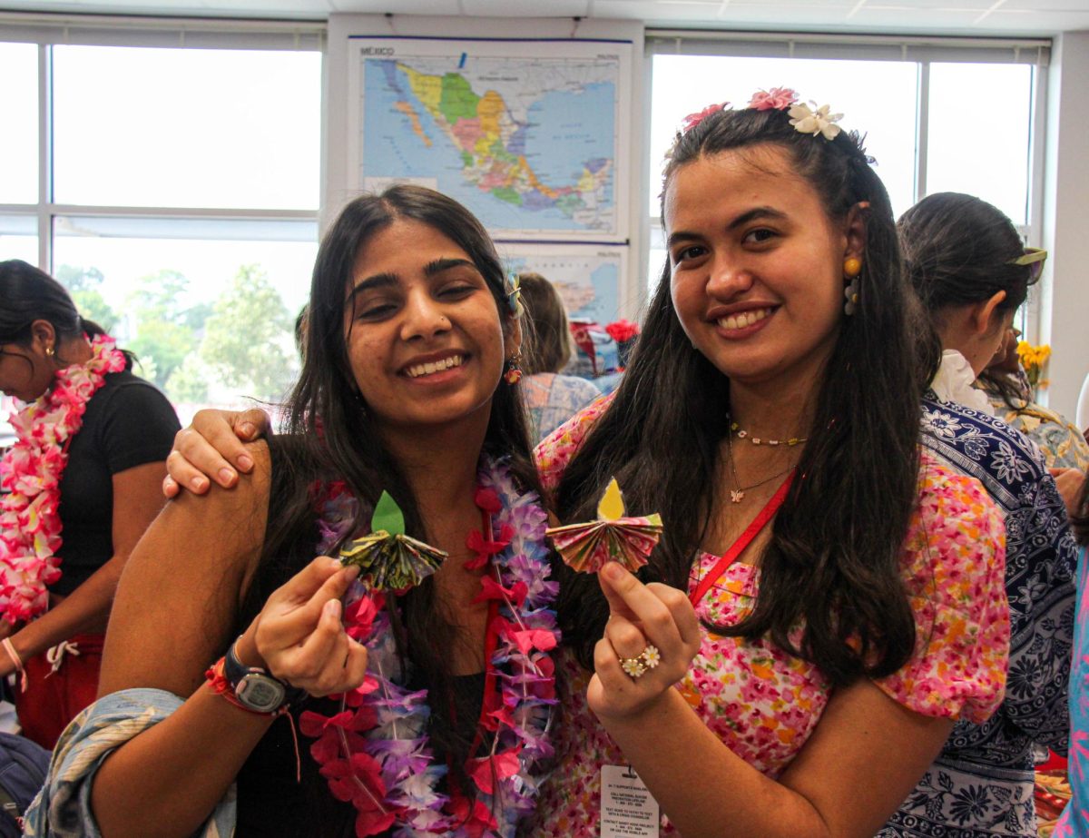 Juniors Shivali Sinha and Josephine Eltzschig display their paper diyas. Diyas represent oil lamps that are commonly used in religious festivals like Diwali.