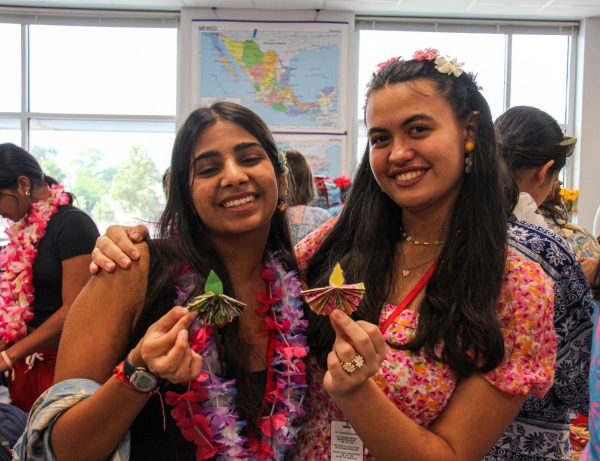 Juniors Shivali Sinha and Josephine Eltzschig display their paper diyas. Diyas represent oil lamps that are commonly used in religious festivals like Diwali.