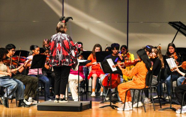 The Bellaire Philharmonic Orchestra plays their instruments while dressed in their Halloween costumes. Their performance consisted of three individual pieces.