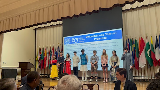 Junior Mallika Mohan, sophomore Kai Fielder, senior Eliza Teo, sophomore Luca Hurtado-Borsa, junior Aayush Khadse, sophomore Benno Walter, sophomore Emmanuelle Patrizi, junior Hanyue Ding and senior Alaa Aboalaess each recite a piece of the United Nations preamble in their respective native languages at the UN Houston 80th Anniversary Gala on Oct. 24. Magnet and Advanced Placement coordinator Yabei Yin originally extended the opportunity to magnet students, but eventually expanded it to all.