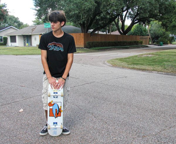 Junior Alessandro Nardi poses with his Lucky Duck Death Wish skateboard. Nardi custom-made the board with his girlfriend over the summer.