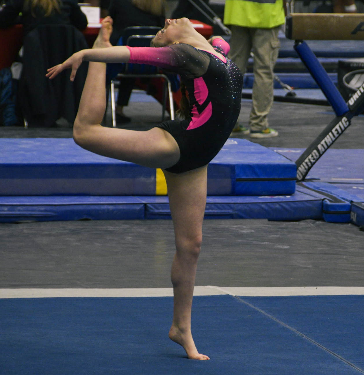 Holliday performs a ring kick at a competition. She took recreational classes for two years before joining a competitive team.