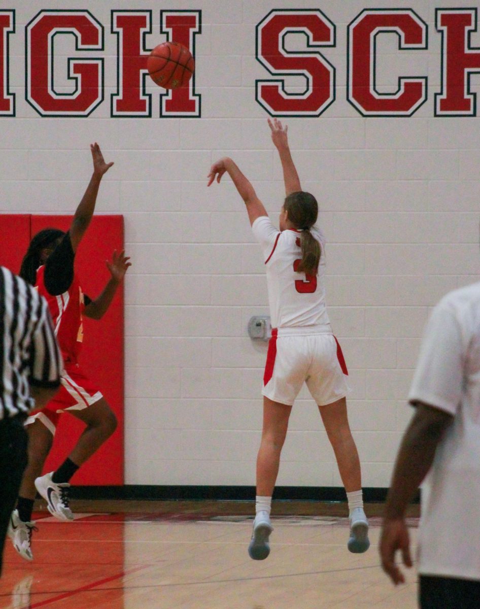 Shooting guard Jenna Dorsey tries to shoot for two points during the first quarter. It is her second year on the team, after joining halfway through her first year.
