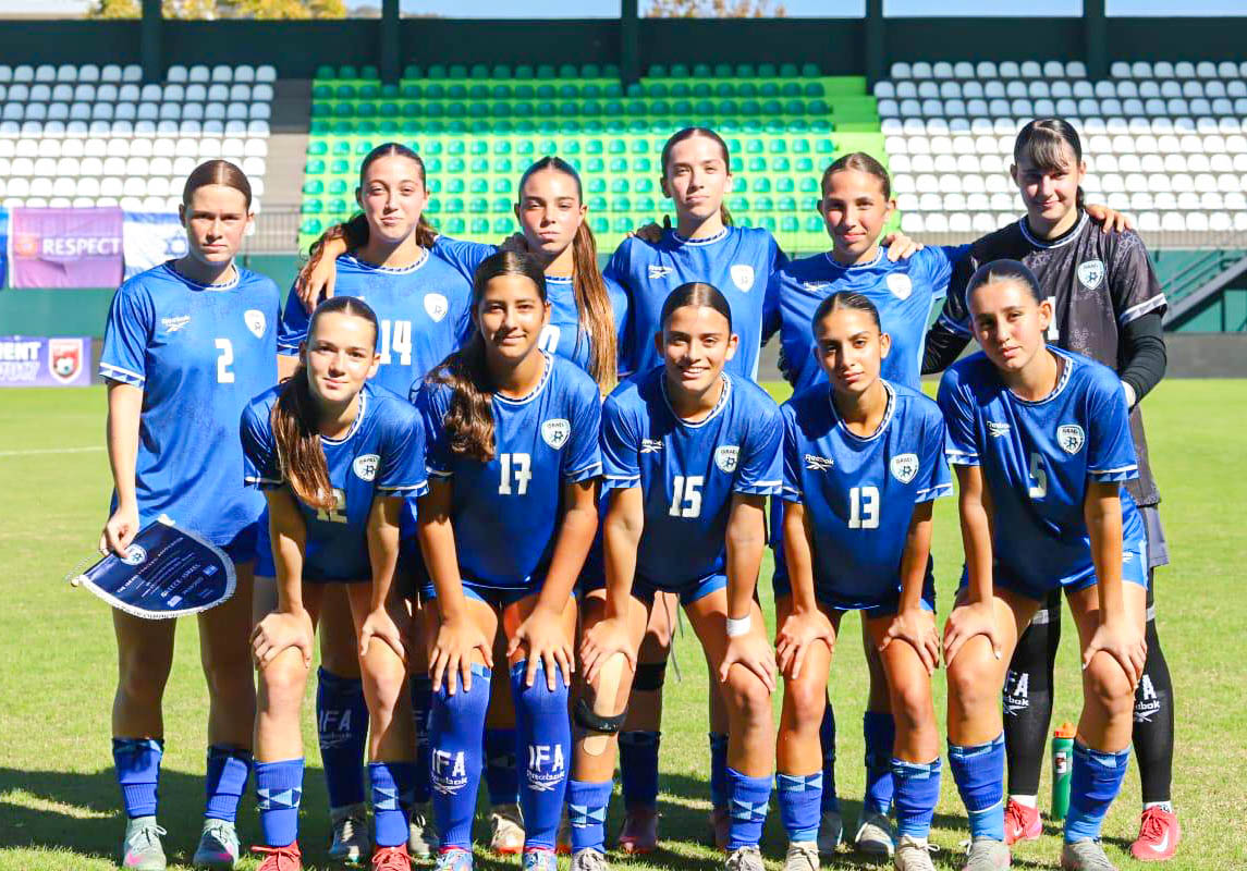 Babajanov (number 17) stands with her team. They won one game and tied the other two, just missing the opportunity for promotion to Group A, a better bracket that could put them in the World Cup.