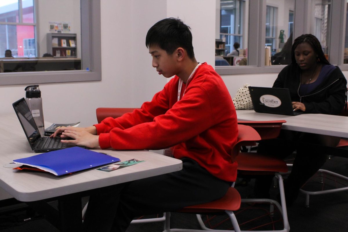 Freshmen Connor Chen and Mackenzie Franklin participate in the quick-write activity. “I liked it because I had to think about what to say in a very short amount of time and just write it down,” Chen said.
