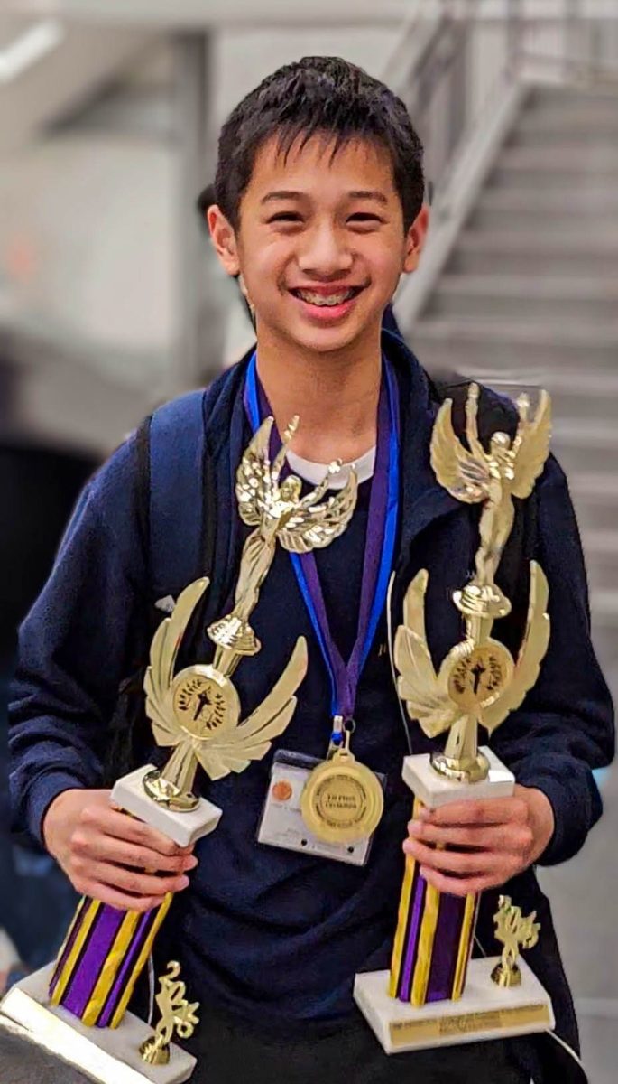 Freshman Connor Chen poses with all of the awards he received from the competition. He received the Latin Scholar of the Year Award (left), first place in the Caramen team competition (middle) and the Geography High Score Award (right).