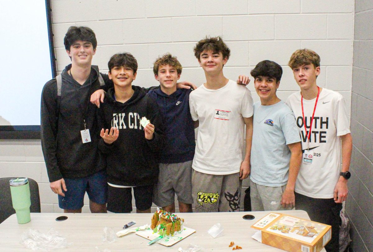 Shane Gordon, Jack Main, Matthew Davies, James McIngvale, Jordan Brown and Harrison Sealock pose with their finished house. They were one of six groups to compete in the building competition.