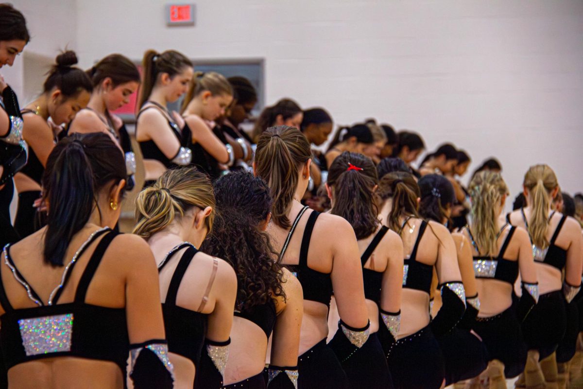 Shortly after walking on, Belles position themselves in their opening formation. They were performing their kick routine to a remix that goes along with the overall theme of “IGNITE.”