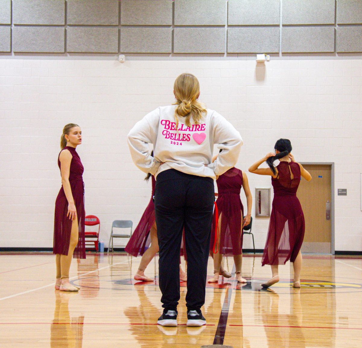 Belles Director Kara Townsend critiques an officer routine. The officers performed a total of three routines at competition, with Townsend advising them throughout the season.