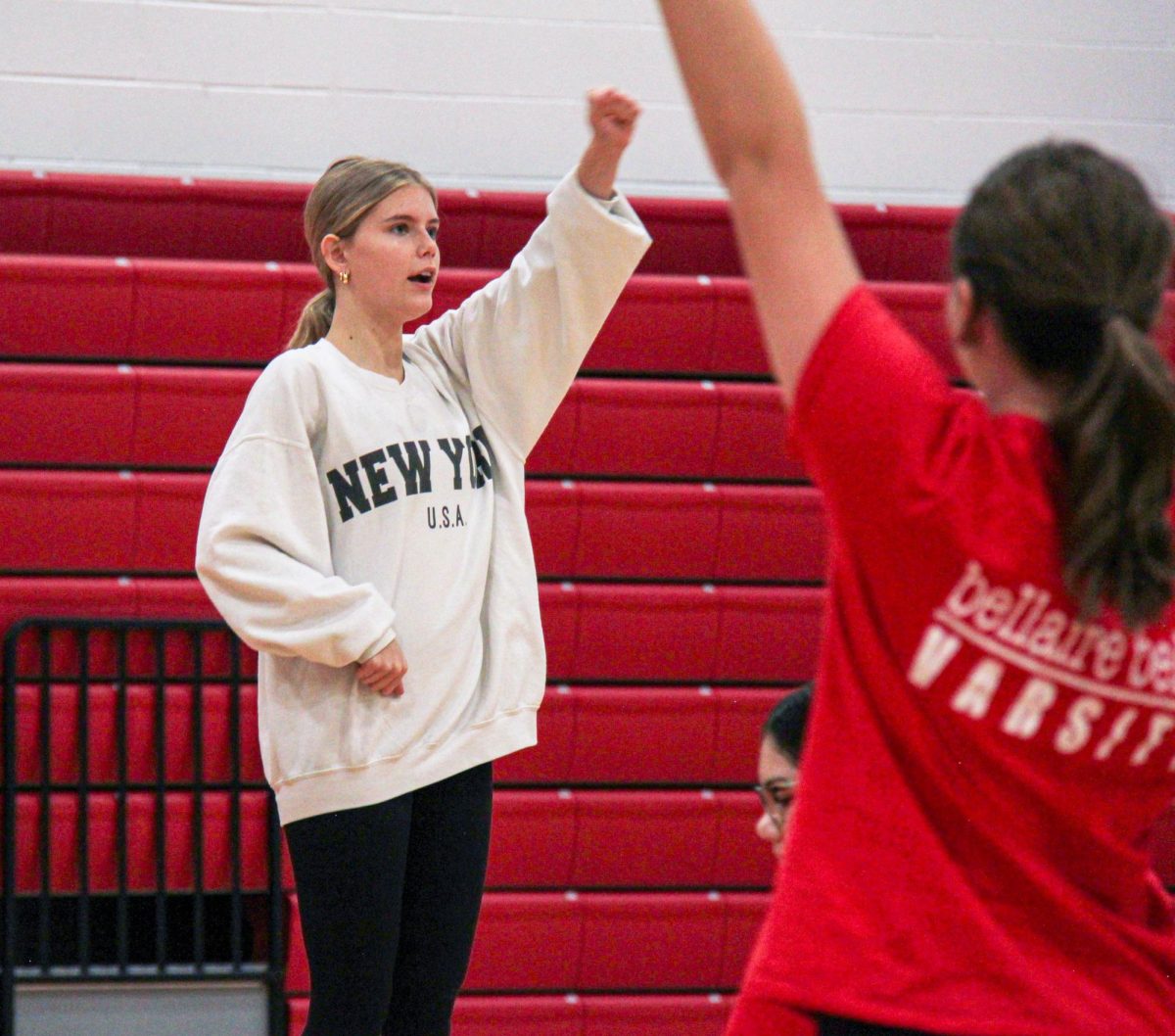 Senior and Co-Colonel Devin Morris clarifies a move during morning practice on Feb. 3. The Belles were cleaning and practicing their pom routine under the guidance of Morris and Townsend. 