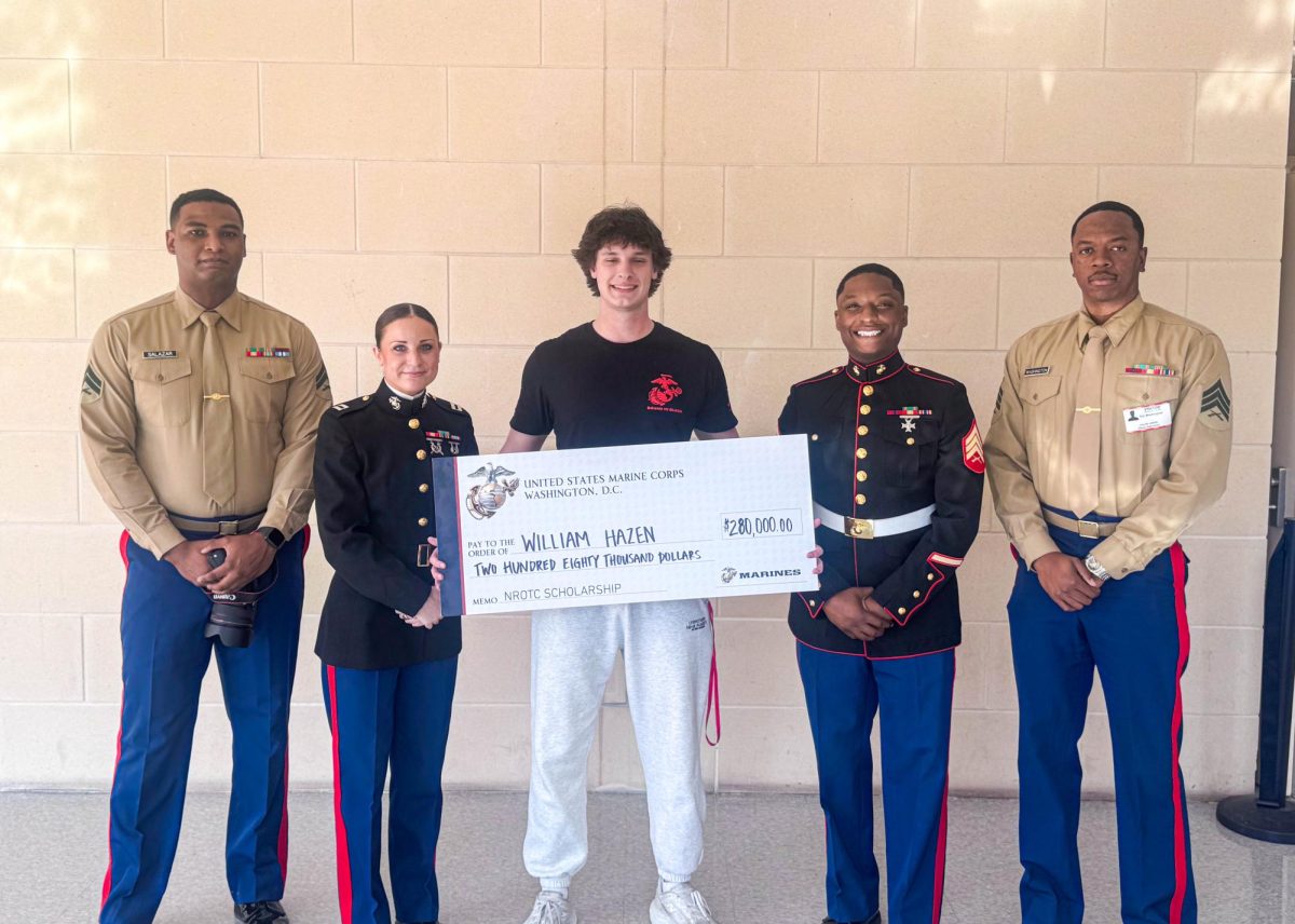 Hazen (middle) stands with Captain Miller (second from left) and the Marines Sergeant (second from right). Hazen said Captain Miller was always there for him and told him “never to be afraid to ask questions.”
