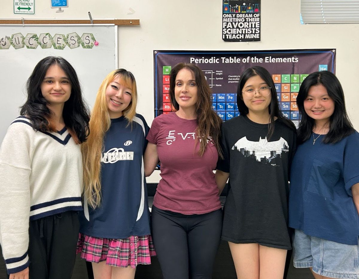 Seniors Jordan Tidwell, Amy Lee, Catherine Xue and Joy Xia pose for an end-of-year photo with Ms. Charbonneau (middle). The group of friends created the ‘Gnarly’ parody video and never anticipated its success. “I remember checking back on the video every hour or so and seeing the numbers rise,” Lee said.