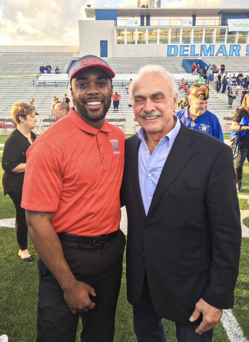 Garnett poses for a selfie with a former NFL player, Pittsburgh Steelers legend Rocky Bleire. Garnett was a football coach for Waltrip High School from 2016-2023.