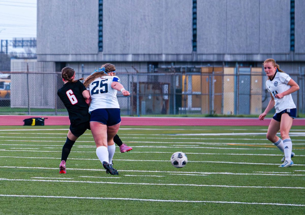 Junior captain and midfielder Lily Baker boxes out on defense. Baker has been on varsity since her freshman year.
