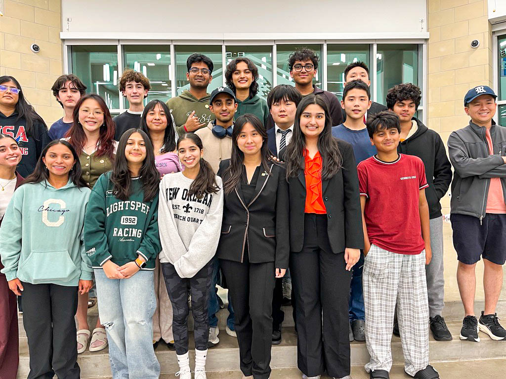The debate team takes a group photo after the awards ceremony at Rock Hill High School. The tournament was split across three locations: Rock Hill High School, Jones Middle School and the University of North Texas Frisco. 