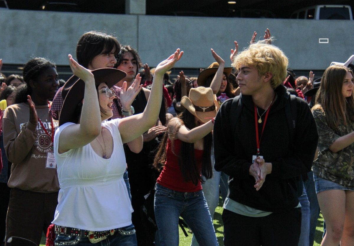 Along with food stands, bull rides and a petting zoo, the Go Texan Day celebration features lively music to dance to. The songs that were played included "Macarena," and "Wobble."